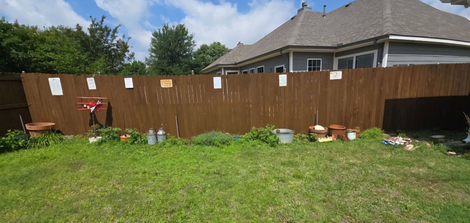 New Gutters, Fresh Fence Stain and Happy Clients in McKinney image