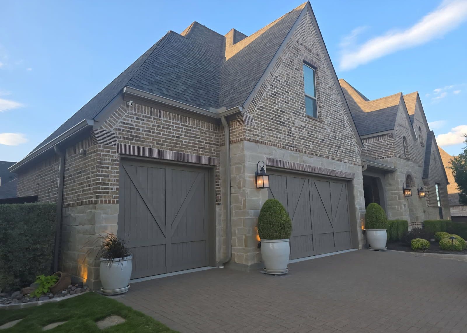 Elegant Home Makeover with New Roof and Gutters image
