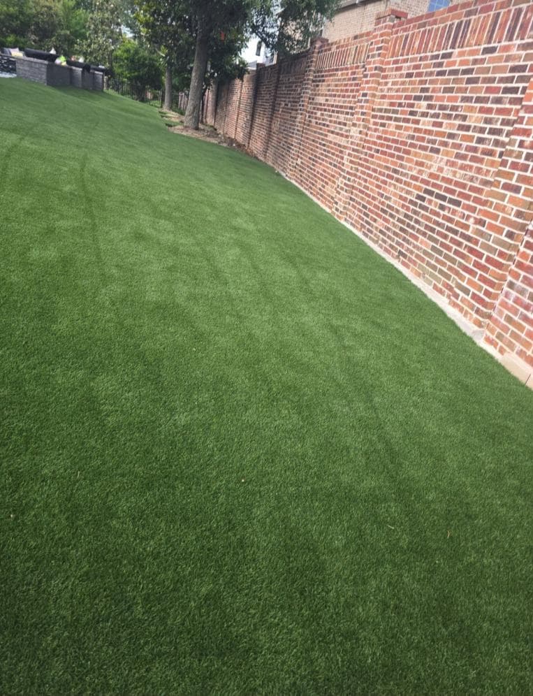 Outdoor Spaces Elevated with Synthetic Turf and Patios image